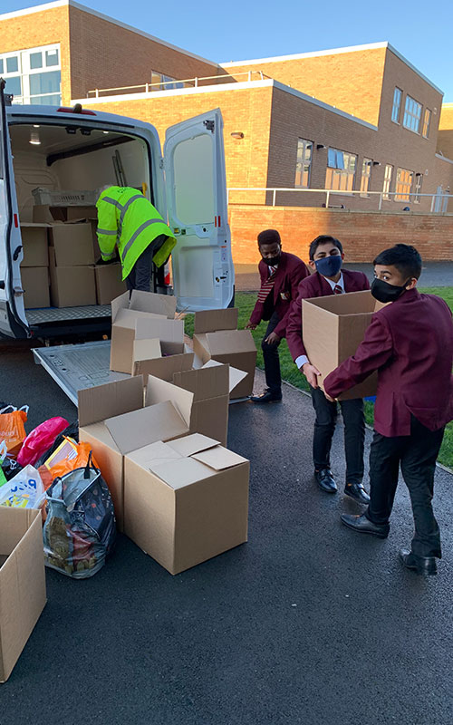 students loading up van for Advent donations